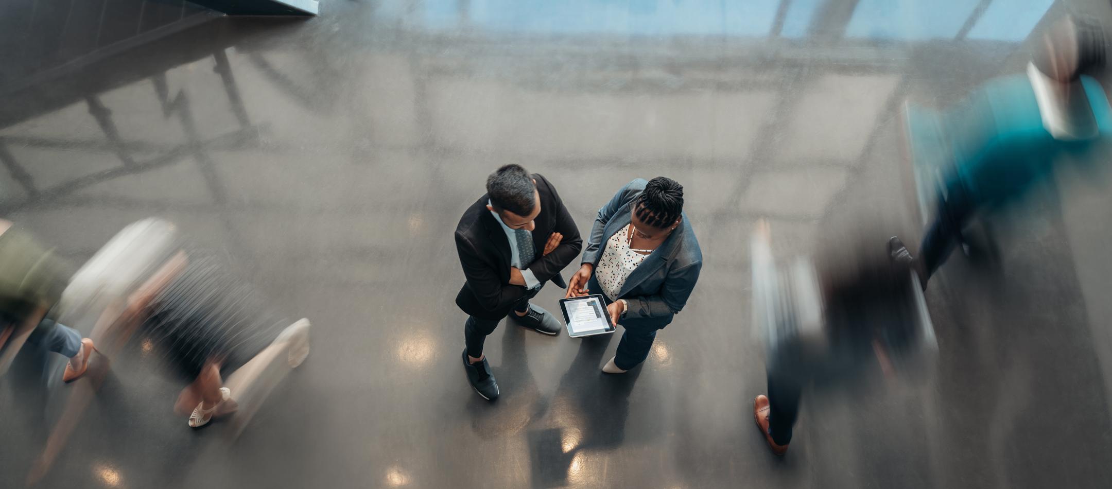 Overhead image of people reviewing a document