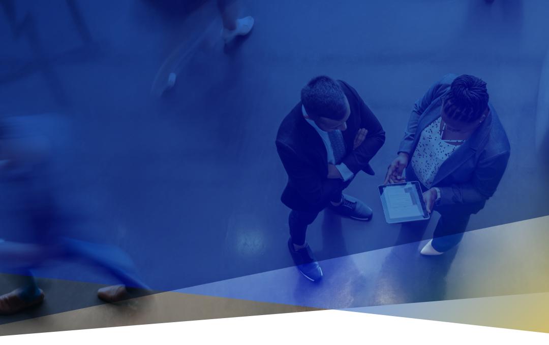 Overhead image of two people in an office lobby