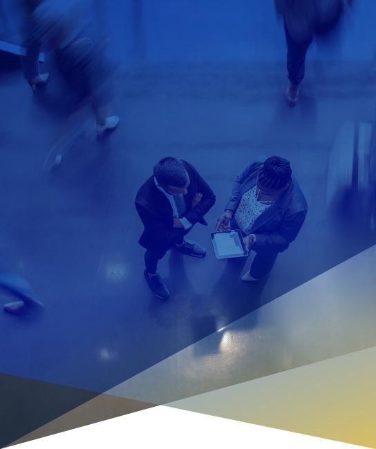 Overhead image of two people in an office lobby